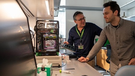 Paul Dalton and Ievgenii Liashenko in the lab