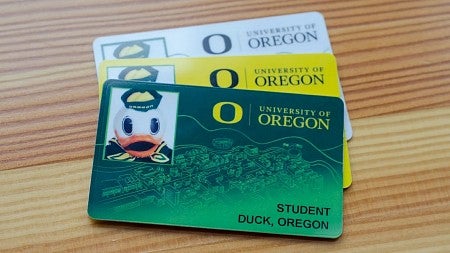 green, yellow and white Duck ID cards