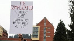 Protest sign with information about the activism forum